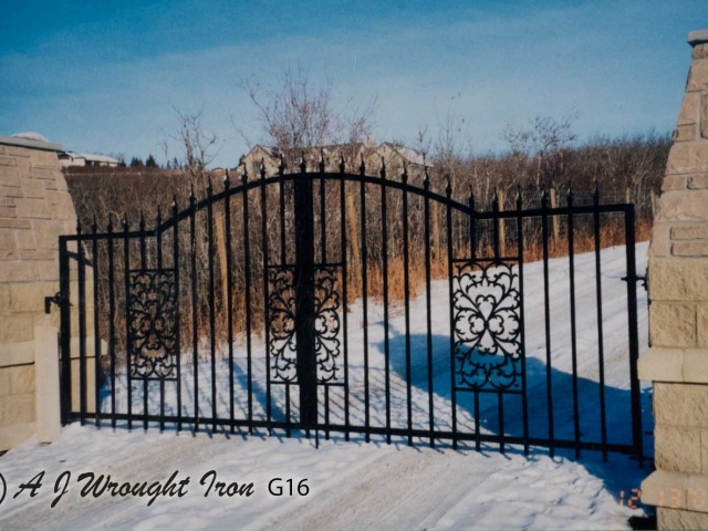 Arched wrought iron driveway security gate