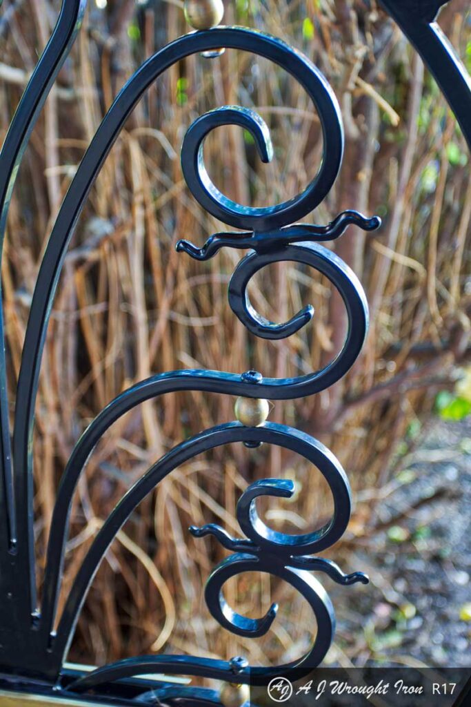forged railing with metal ball