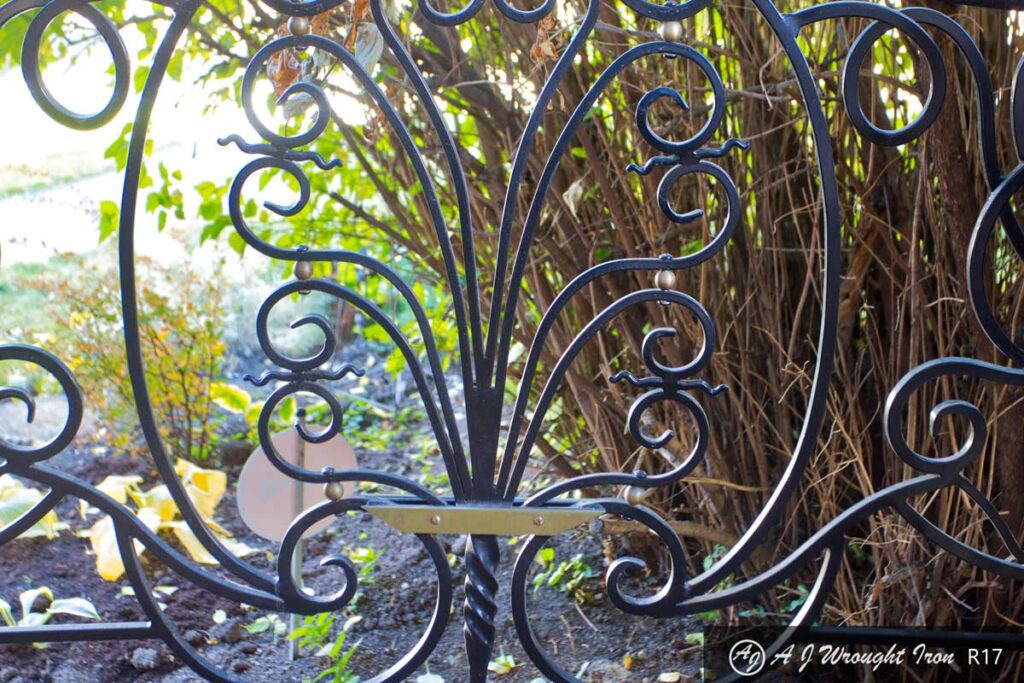 iron railing plant motif with twisted iron trunk