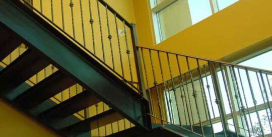 staircase railing with twisted iron spindles