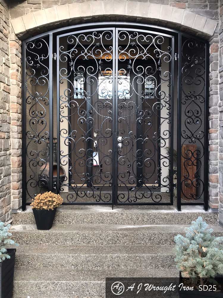 black wrought iron security door with leaf and vine design