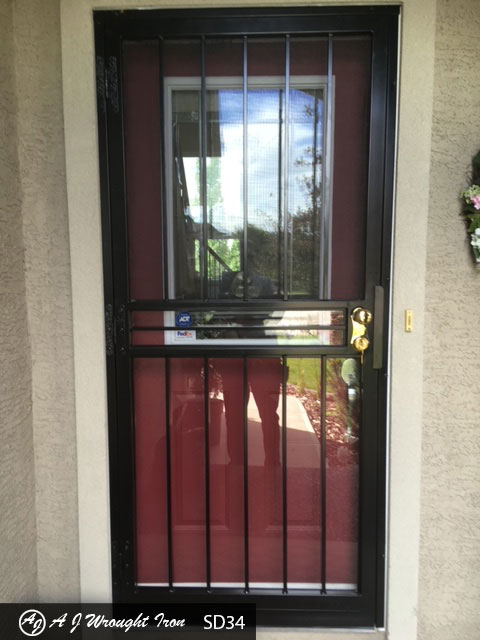 dark brown - plain style security door on residential home