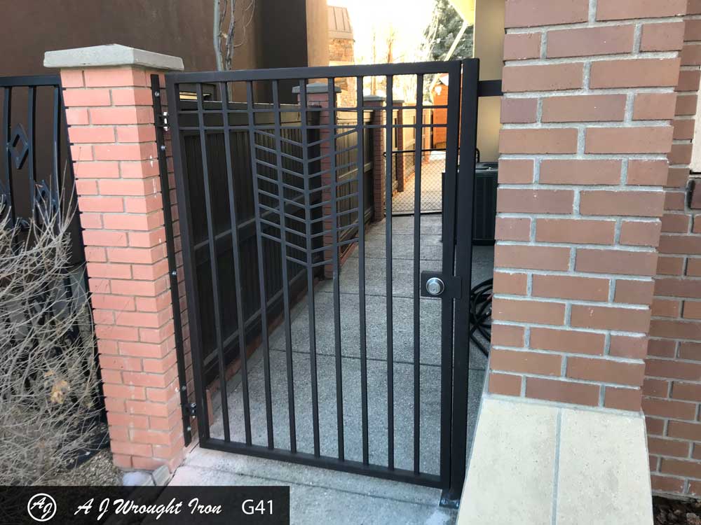 wrought iron property gate across sidewalk
