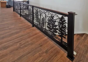 railing baluster created by laser cutting a forest motif into a metal sheet