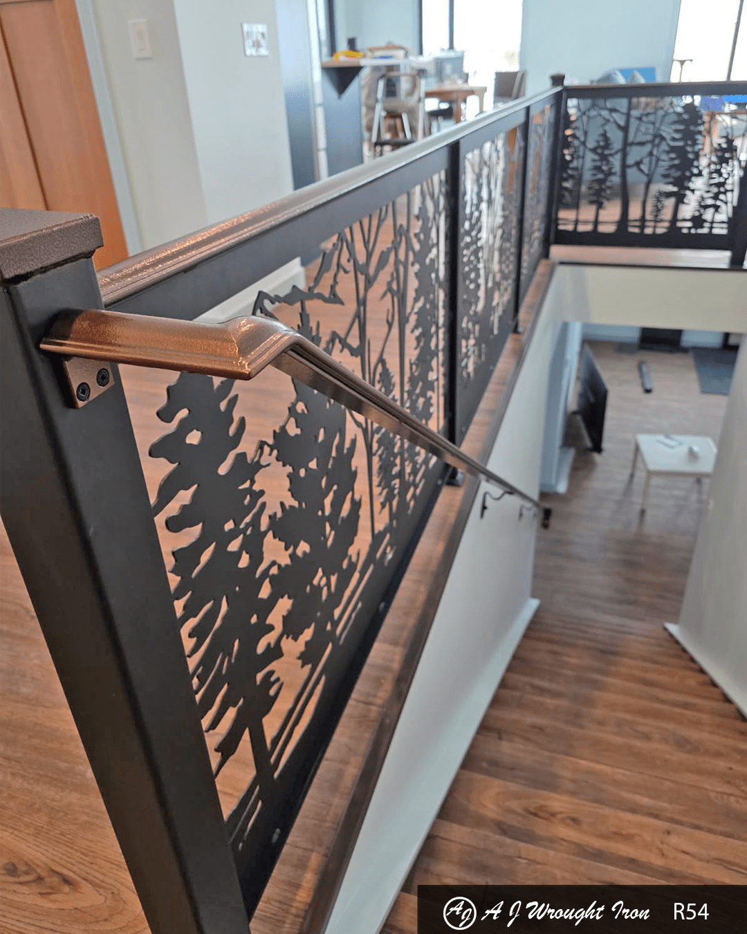 R54 Copper railing with custom laser cut baluster Copper railing with custom laser cut baluster looking down stairs