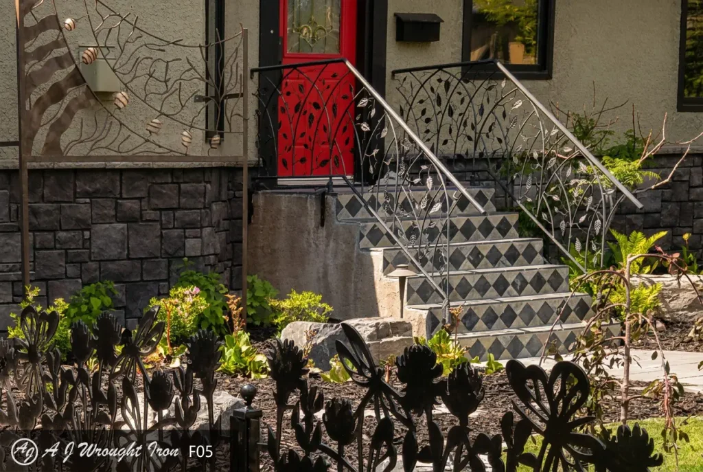 metal railing with leaf and branch motif